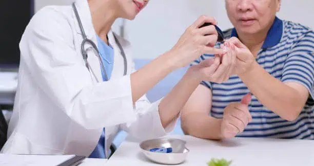 a doctor checking blood sugar level