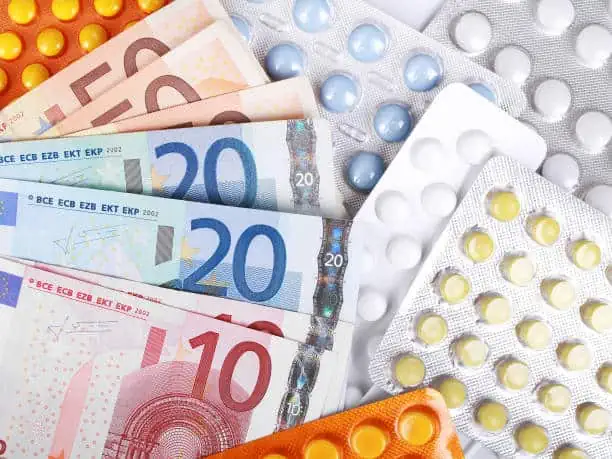 Euro money bills and colorful pills