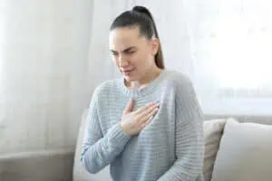 Woman suffering asthmatic symptoms