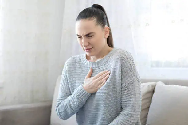 Woman suffering asthmatic symptoms
