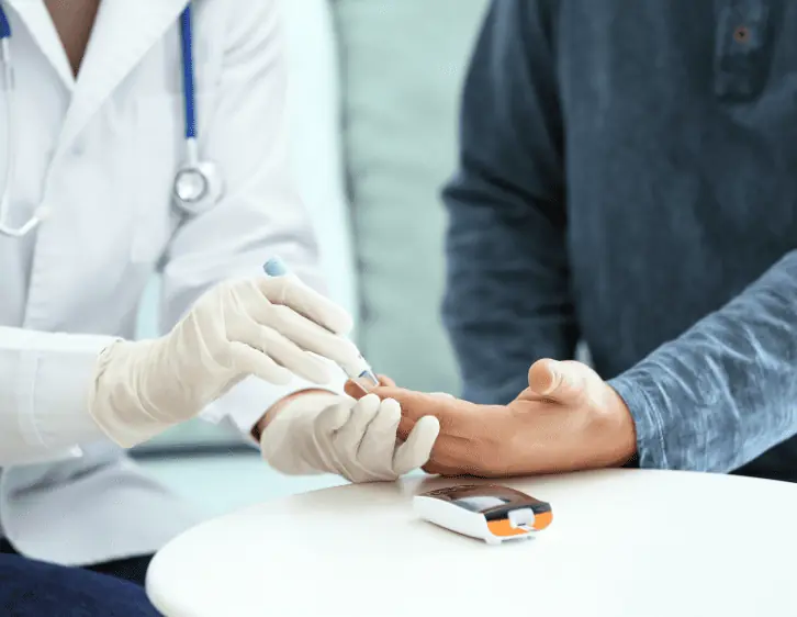 A doctor checking blood sugar