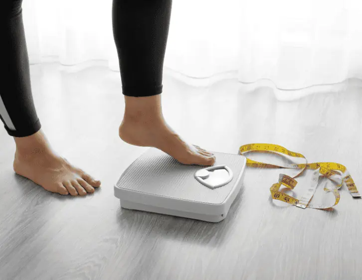 Woman weighing weight