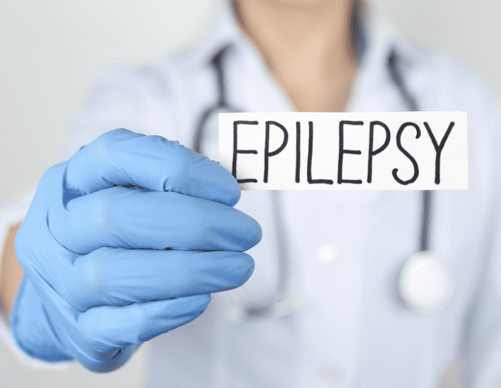A doctor holding a card with a word epilepsy